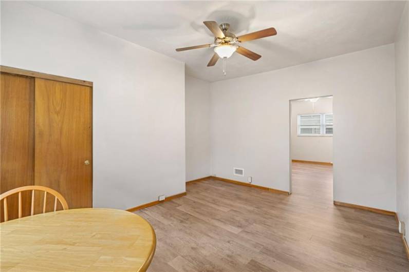 The living and dining area looking into the spacious bedroom