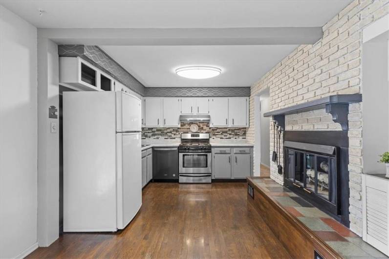 Cozy fireplace in the kitchen.