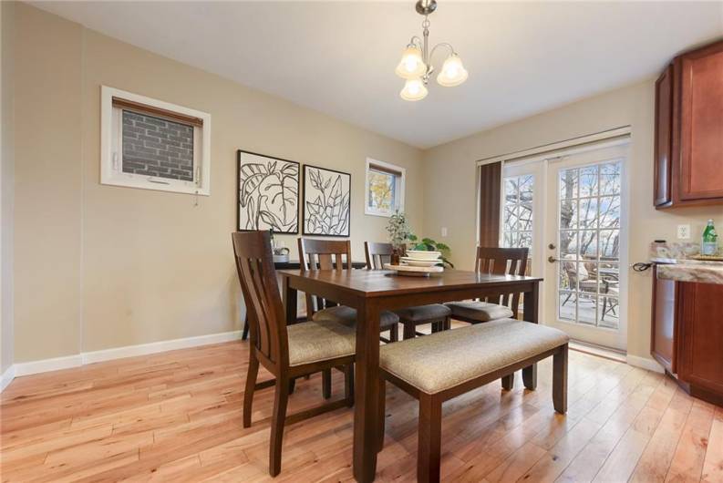 Dining area with double doors leading to back deck