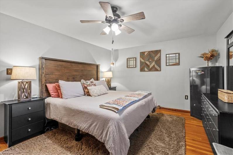 Master bedroom with gorgeous hardwoods!