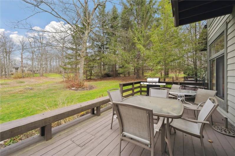 The deck, with built-in sitting, is accessed from the family room and backyard area.