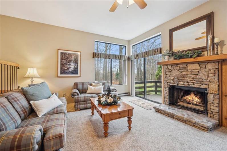 The main-level family room | living room measures approximately 17'8