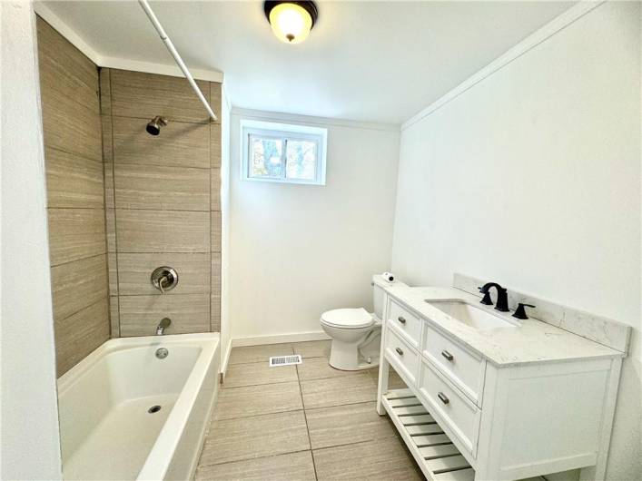 The nicely appointed updated baths offer space for everyone.