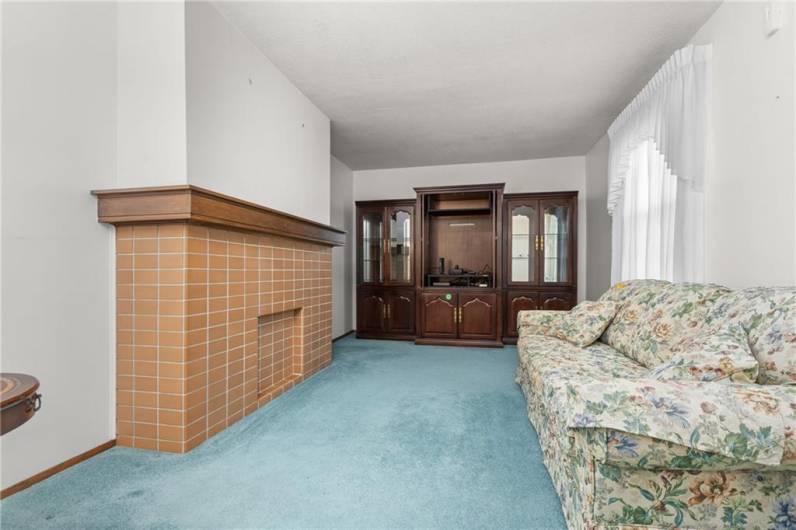 View of the huge living room that boasts a decor. fireplace