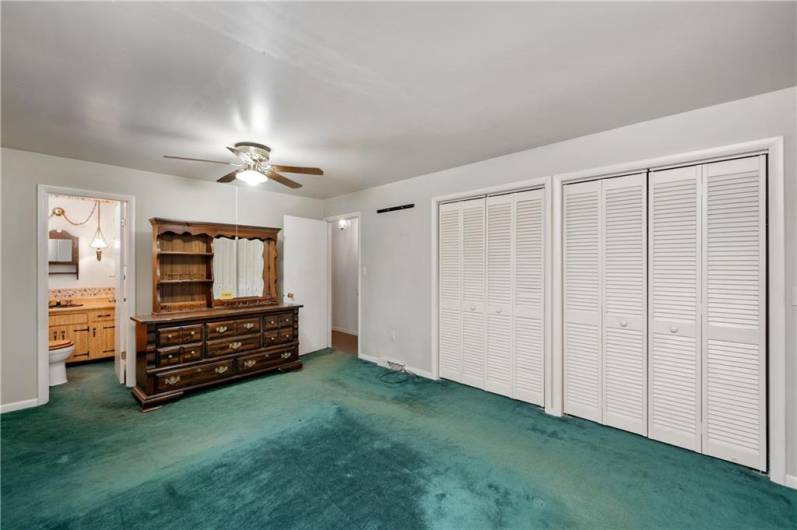 Primary Bedroom with attached Half Bathroom on Main Level