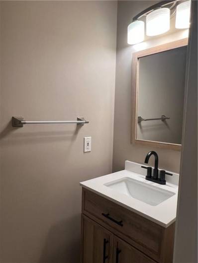 Powder room on first floor by laundry