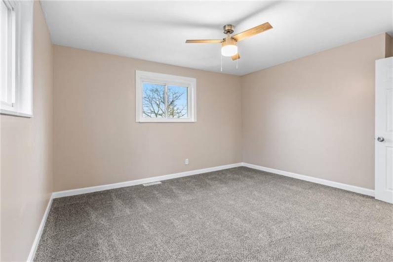 Bedroom 2 - Enjoy brand new carpet, paint and ceiling fan.