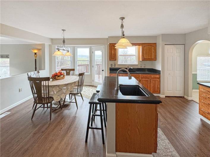 Center island with room for bar stools.  Breakfast area with door leading to deck.