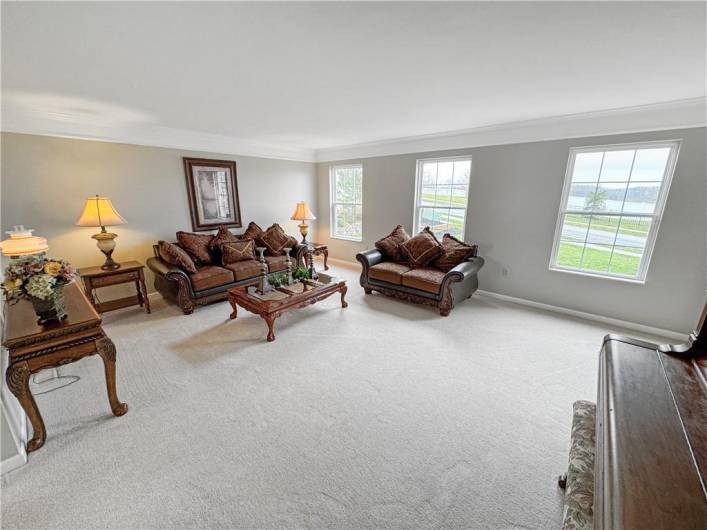 Huge living room is freshly painted.