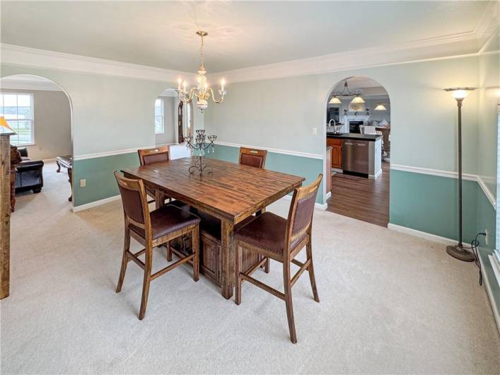 The banquet sized dining room has crown and chair rail moldings.