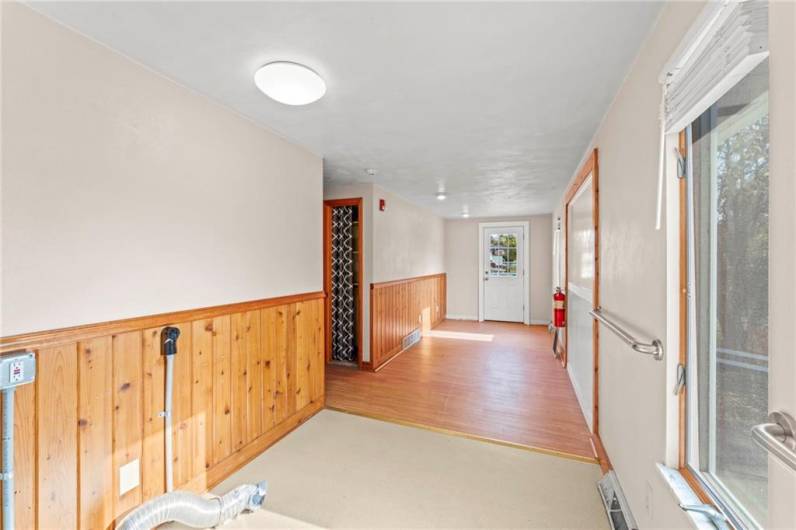 First floor bonus room that leads onto the back deck.  The washer and dryer hookups are here.