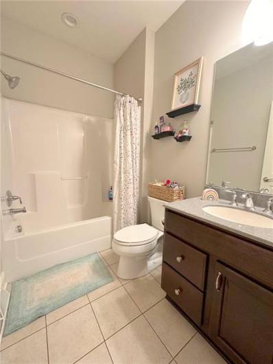 Full Bath #2 is also on the main level with a ceraic tile floor and cherry cabinetry.