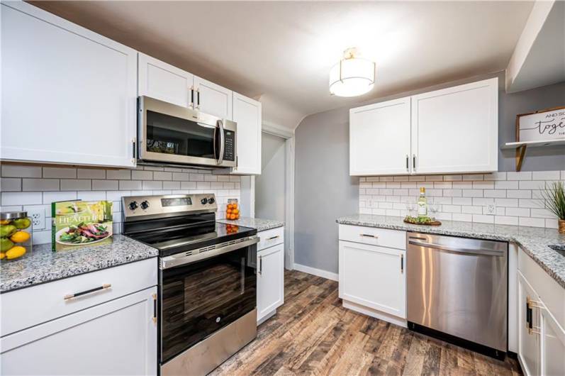 All new stainless steel appliances to cook and clean with ease! Check out the subway tile back splash with a light grey grout.