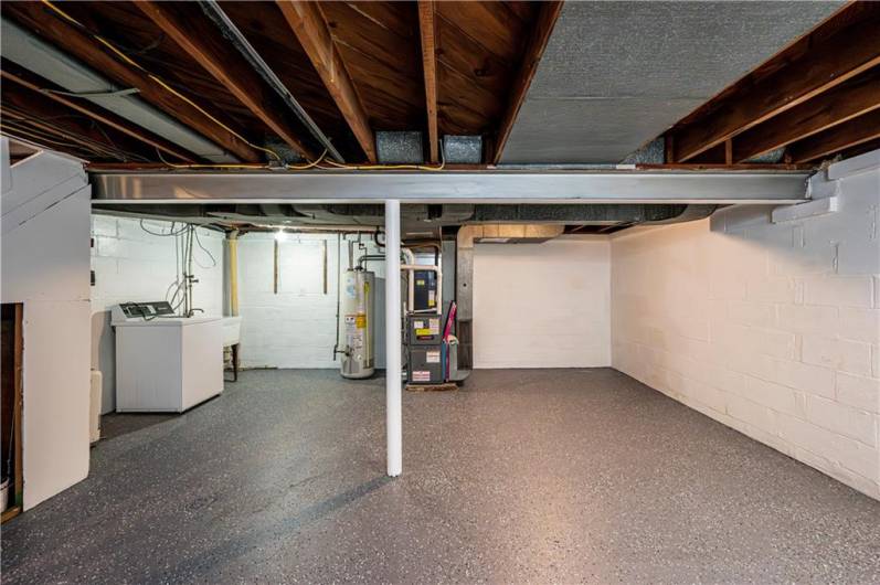 A nice clean and freshly painted basement area.