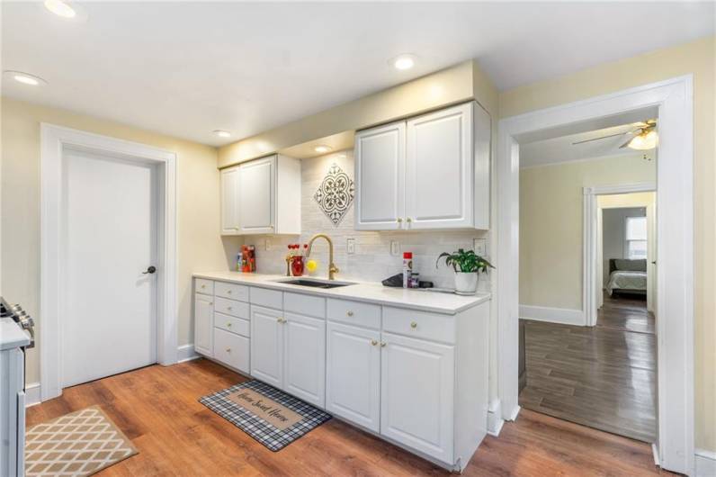 updated unit with newer kitchen and pretty backsplash