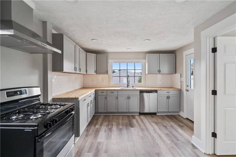 New backsplash flooring and pocket lighting finish this space off perfectly.