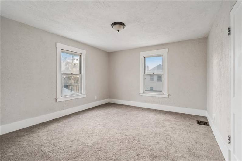 Upstairs you will find spacious bedrooms with new carpet, paint & light fixtures.