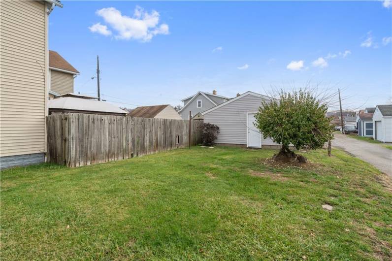 Additional view of the backyard. Walk into the garage.