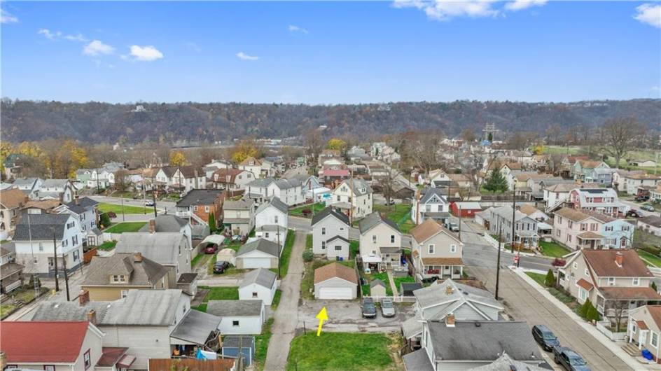 Aerial view of the back of the property showcasing the 2 car detached garage.