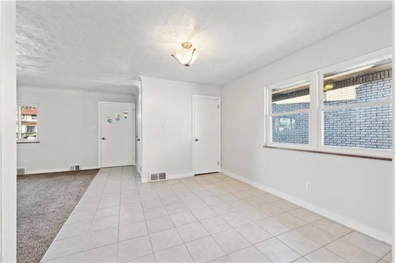 Another angle of this ample space to be a dining room or eat-in kitchen.