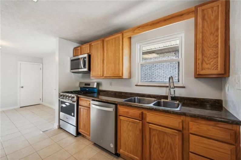 The kitchen has all new stainless-steel appliances.