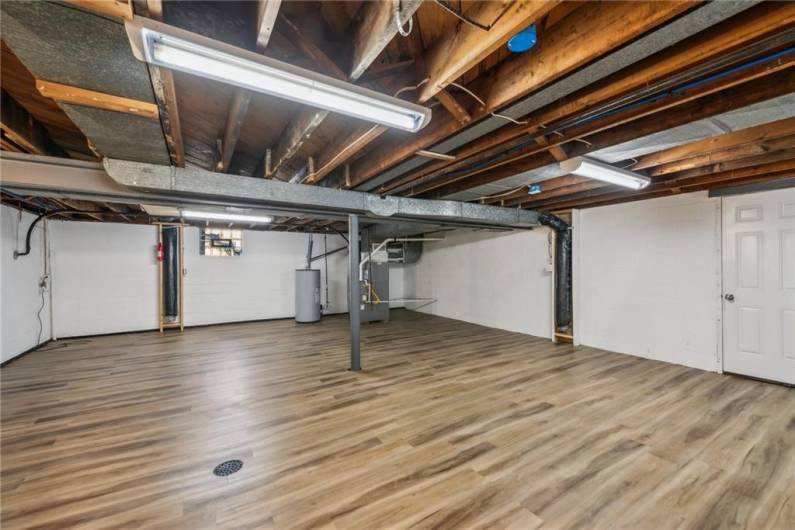 Huge basement with beautiful new flooring.