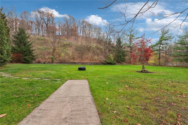 beautiful, tranquil, outdoor area with firepit.  Plenty of greenspace (that you don't have to mow!)