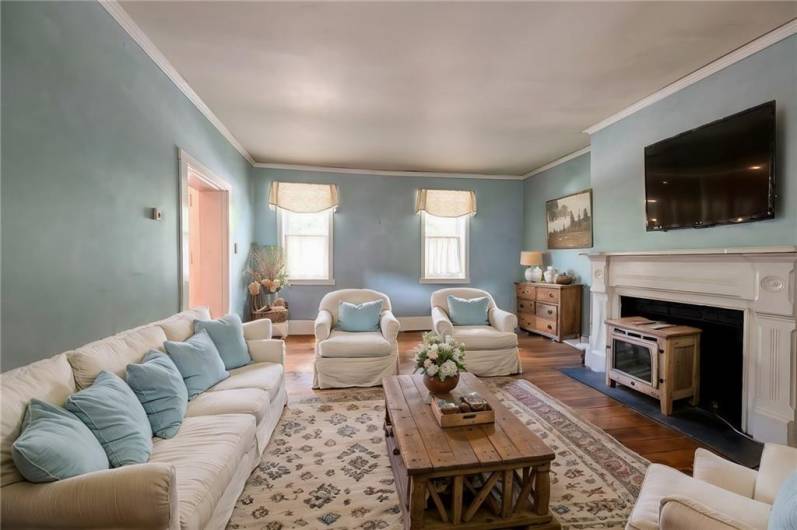 Staged living room true to color and features of the space.