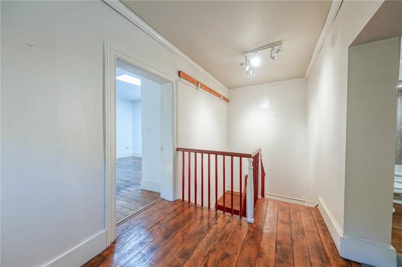 The den or sitting area is at the top of the stairs showcases built in bookshelves.