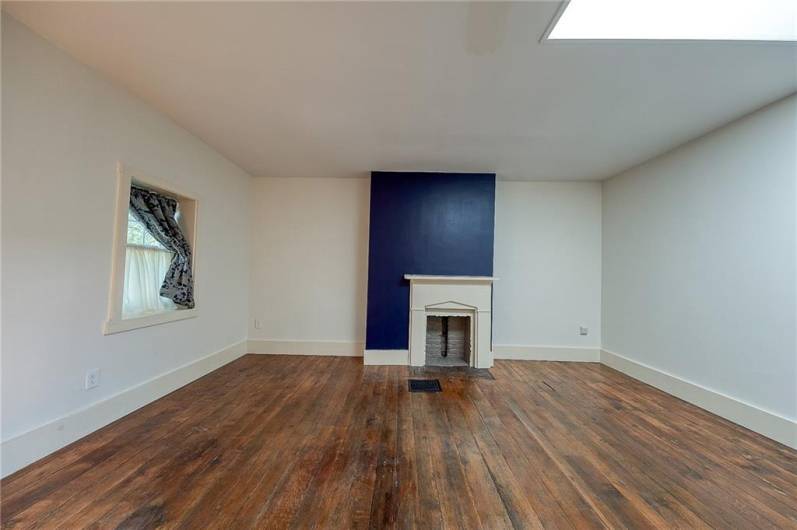 Fireplace is decorative. The large walk in closet has a light and opens from both sides.