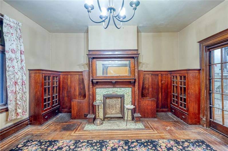 AMAZINGLY PRESERVED BUILT IN CABINETRY AND SEATING PLUS FRENCH DOORS.