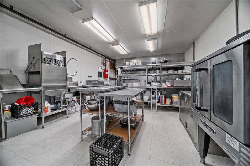 Back entry view of Kitchen. Dishwasher not included.