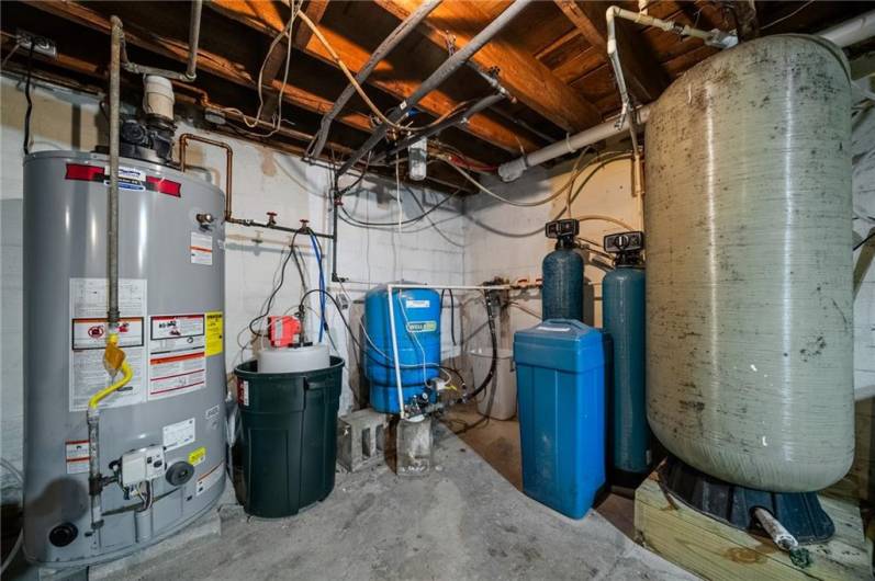 Basement - Hot water tank, well set up with holding tank, softener system, holding tanks, etc.