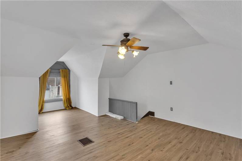 Another View of the Large Finished Third Floor with Newer Wood-Look Floors and 2 Windows.