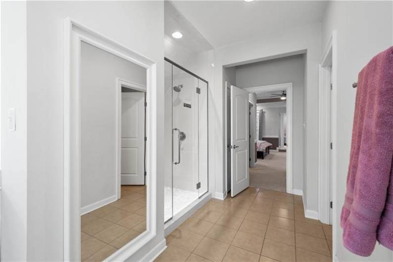 Owner's Suite with Dual Vanities, Soaking Tub, Tile Shower & Private Water Closet.