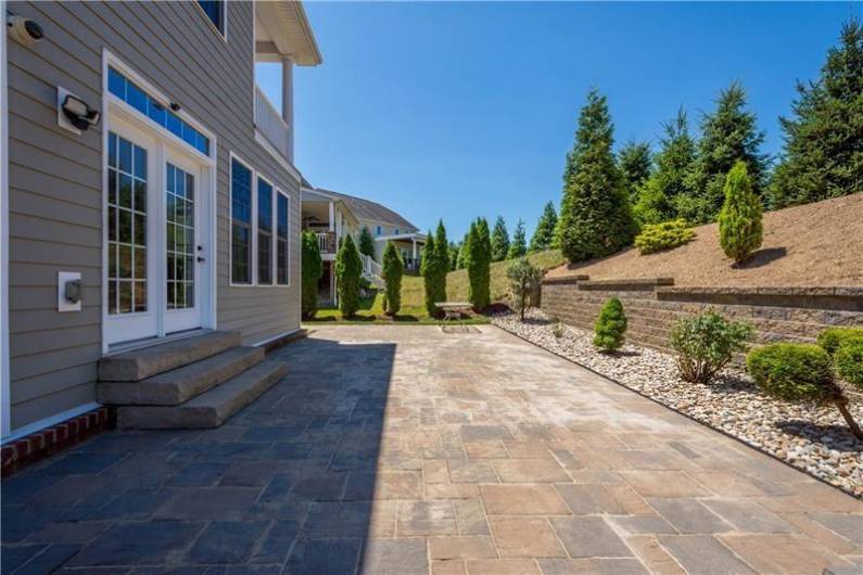 Stone Patio and beautiful landscaping outback. Plenty of room for outdoor dining and entertaining!