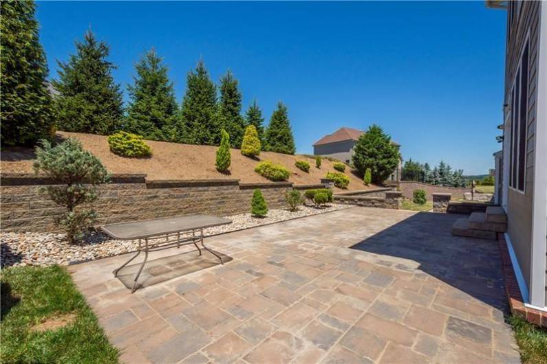 Stone Patio and beautiful landscaping outback. Plenty of room for outdoor dining and entertaining!