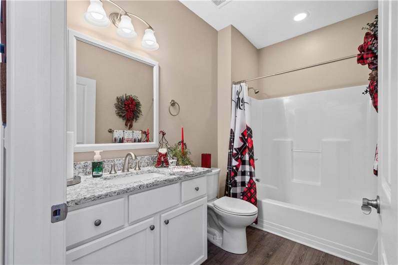 527 FAIR MEADOW DR. GUEST BATHROOM WITH QUARTZ COUNTERTOP, AMPLE STORAGE AND A TUB/SHOWER COMBO.