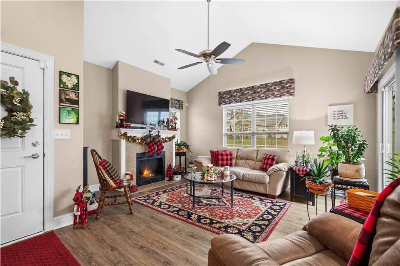 527 FAIR MEADOW DR LIVING ROOM. NEWER FLOORING, GAS FIREPLACE AND NATURAL LIGHT MAKE THIS A GREAT SPACE FOR CONVERSATION.