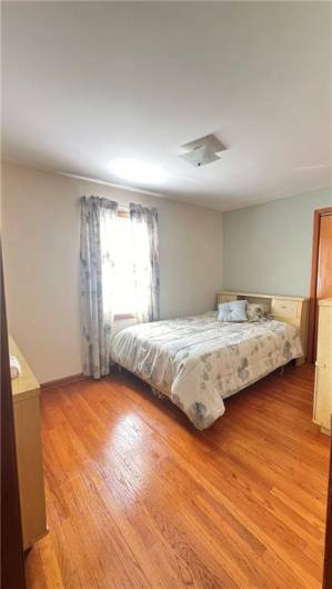 middle bedroom with beautiful hardwoods