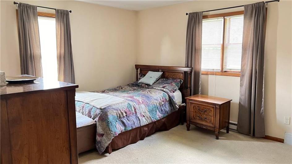 The primary bedroom is spacious with ample closet space, hardwoods are not in this room