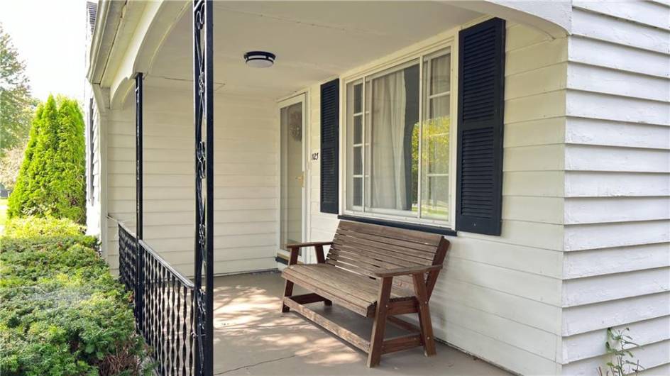 Welcome your guests or just relax  and enjoy the peaceful front porch