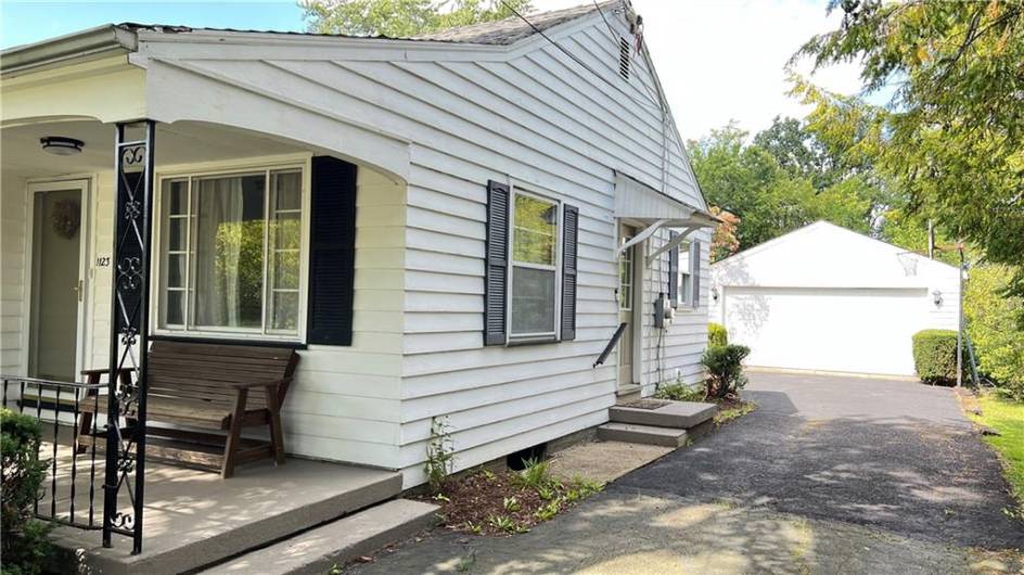 large driveway leads to 2 car detached garage