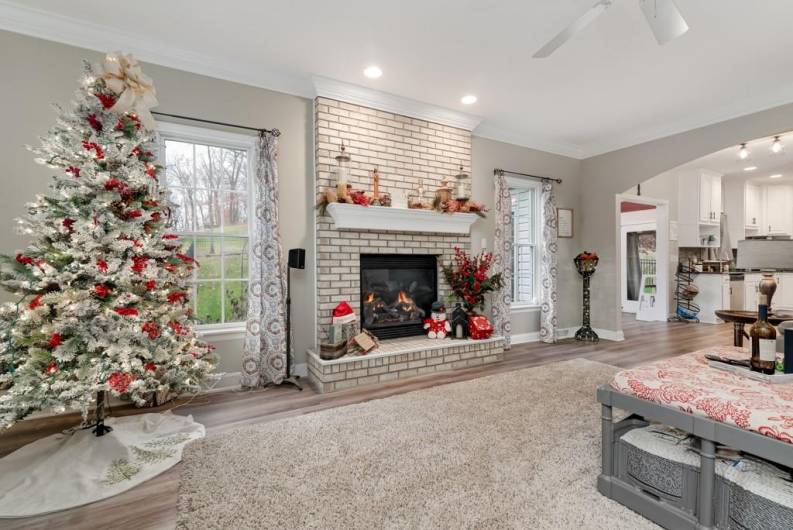 family room is ready for your next gathering with the cozy fireplace