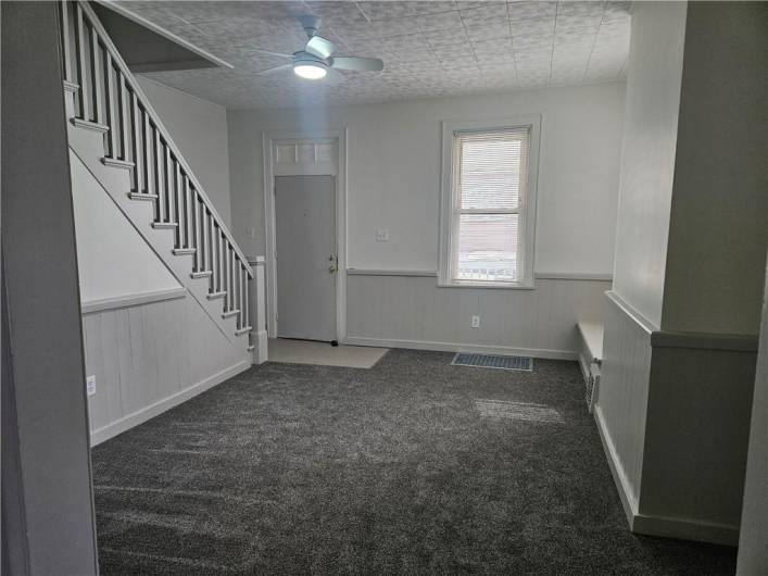 Enter into living room. All new carpeting, paint and lighting