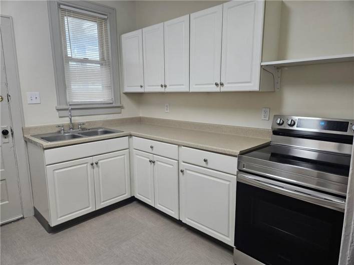 Newly remodeled Kitchen with Stainless steel appliances including Electric Stove, Dishwasher and Refrigerator