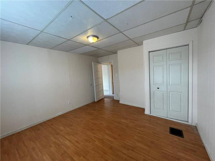 2nd bedroom features laminate flooring & a large closet.