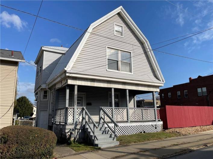 Welcome to 1031 N. Croton Ave. Features include a metal roof & over-sized gutters.