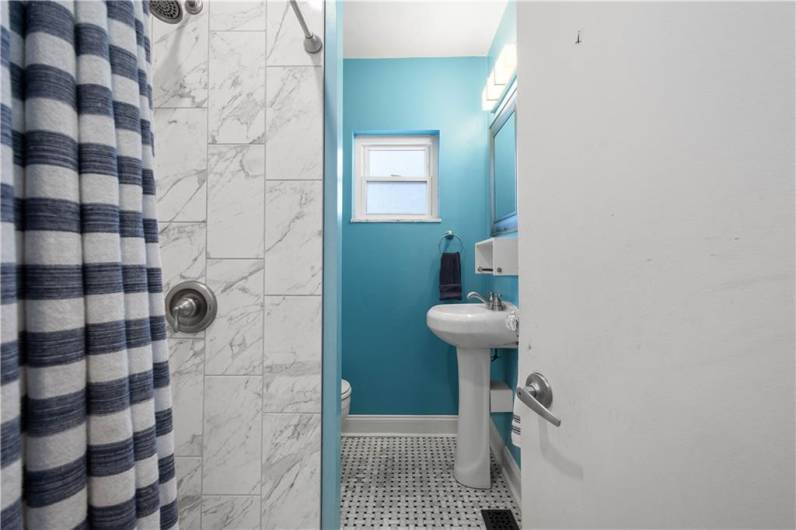 Tastefully designed with a walk in shower.