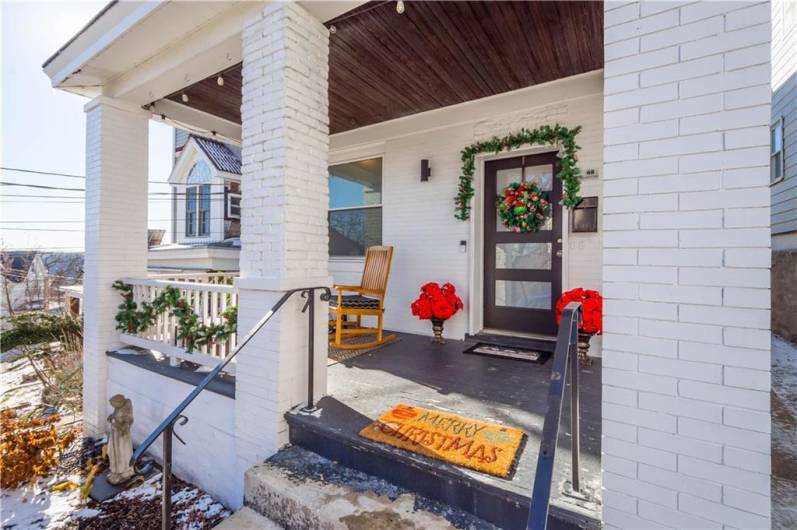 Enjoy your morning coffee on the adorable front porch!